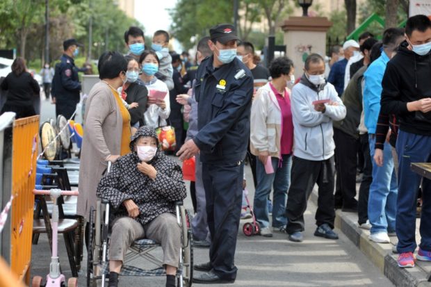 Nearly half of Chinese city of 9 million swabbed for virus in two days