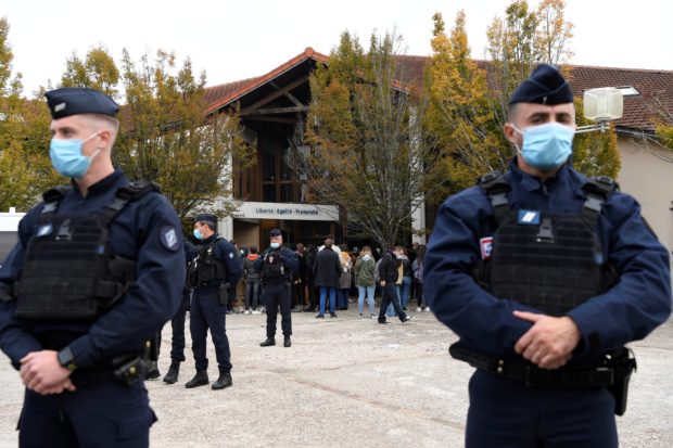 French police raid Islamist groups after teacher's beheading