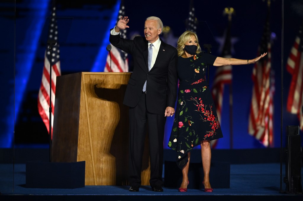 US President-elect Joe Biden stands with wife Jill Biden after delivering remarks in Wilmington, Delaware, on November 7, 2020, after being declared the winners of the presidential election. (Photo by Jim WATSON / AFP)