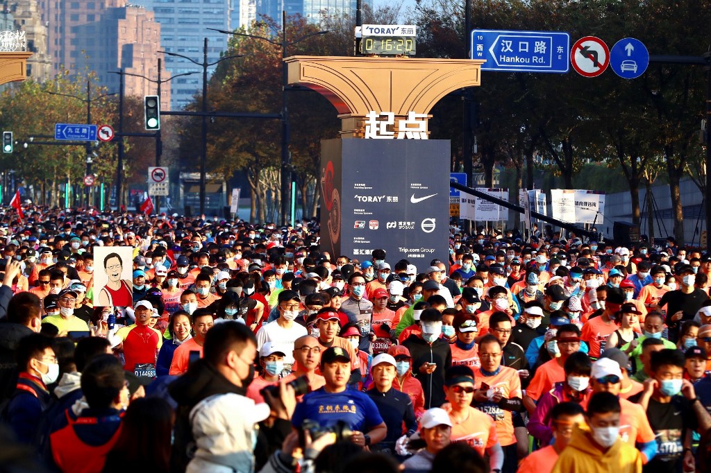 Runners take part in the 2020 Shanghai marathon in Shanghai on November 29, 2020. (Photo by STR / AFP) / China OUT