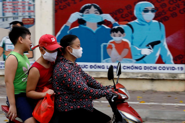 Vietnam opts for containment over 'high risk' rush for costly vaccine