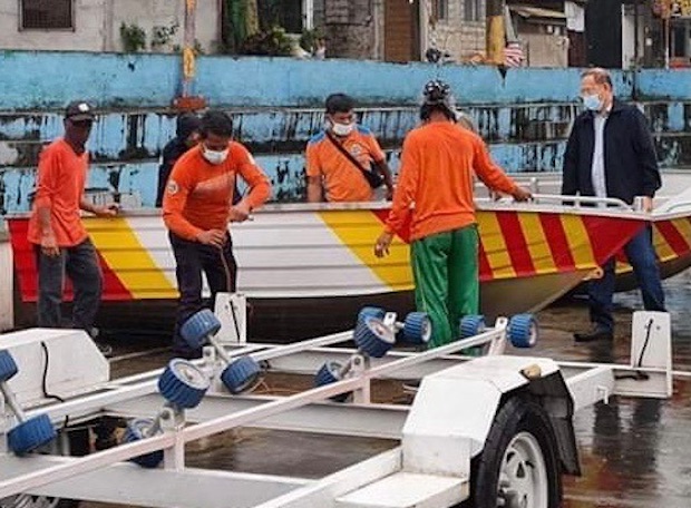Marcelino Teodoro inspecting rescue boat
