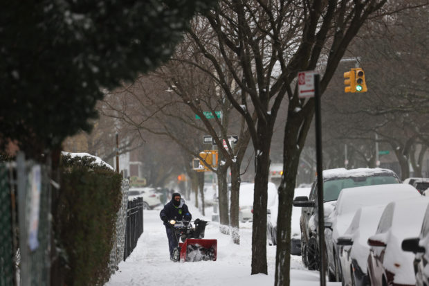 Snow brings joy, and misery, to pandemic-weary New York