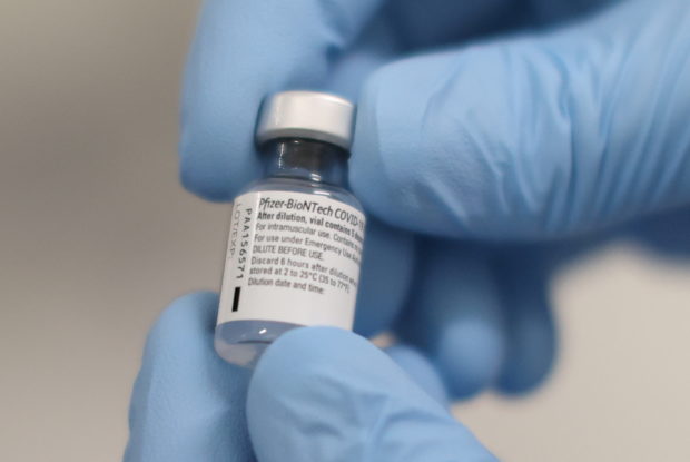 In COVID-19 milestone for West, Britain starts mass vaccination