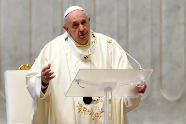 Pope urges help for poor at low-key Christmas Eve Mass curbed by COVID