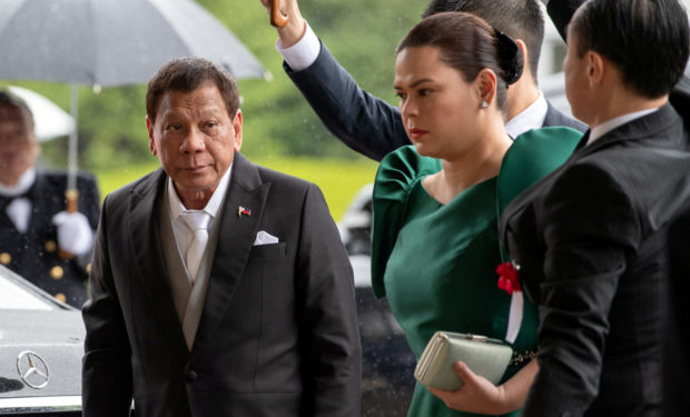 FILE PHOTO: Philippines President Rodrigo Duterte arrives with daughter and first lady Sara Duterte-Carpio to attend the enthronement ceremony of Japan's Emperor Naruhito in Tokyo, Japan October 22, 2019. Carl Court/Pool via REUTERS