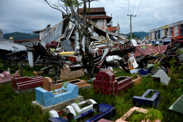 General view of collapsed buildings following an earthquake in Mamuju, West Sulawesi