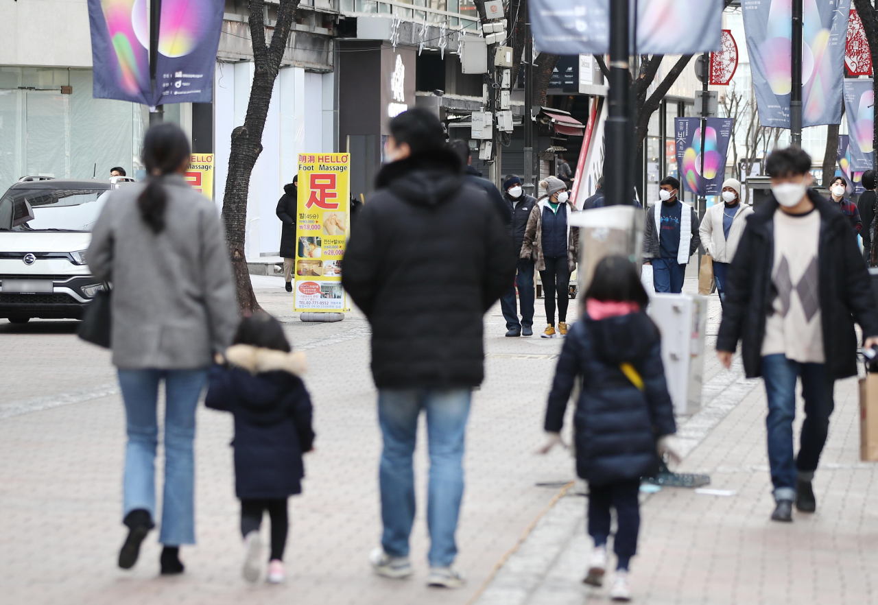 family strolling in myeong-dong seoul South Korea
