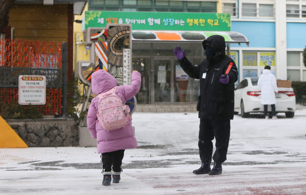 elementary school kid in jeju island South Korea snow winter
