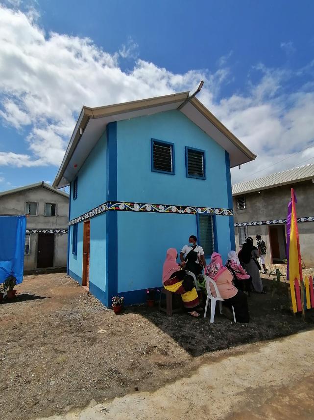 Photos courtesy of UN Habitat PERMANENT HOME. Some 109 families displaced by the 2017 war in Marawi City were awarded houses constructed with a grant from the Japanese government. Housing secretary Eduardo del Rosario hopes that these permanent hopes would help the families rebuild their lives. 