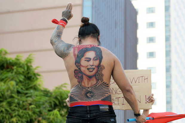 Myanmar protester with tattoo