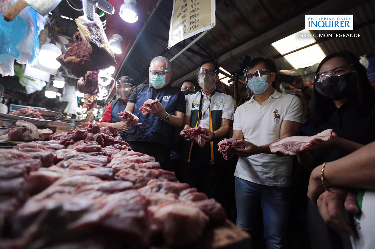 Meat vendors in Commonwealth Market, Quezon City 1
