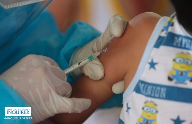 Closeup of child’s arm being vaccinated. STORY: DOH extends vax drive vs, measles, rubella, polio to June 15
