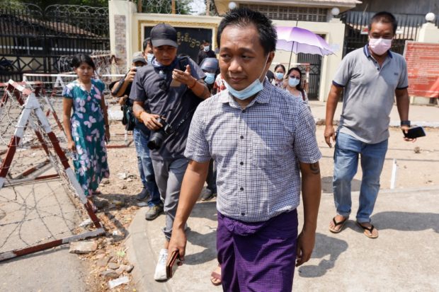 Associated Press (AP) photographer Thein Zaw walks after being released from Insein prison in Yangon on March 24, 2021, where he had been held with others detained for taking part in demonstrations against the military coup