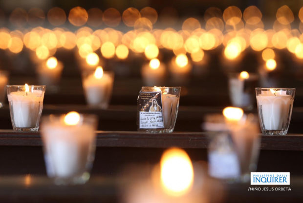 Lighted candles on the empty pews of the St. Peter Parish: Shrine of Leaders in Quezon City. STORY: Holy Week death toll reaches 21 in Luzon