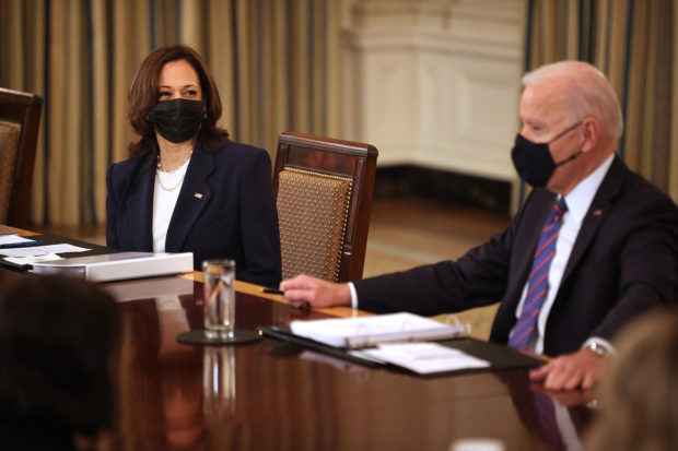 U.S. Vice President Kamala Harris (L) and President Joe Biden meet with cabinet memebrs and immigration advisors in the State Dining Room on March 24, 2021 in Washington, DC. With the number of migrants apprehended at the U.S.-Mexico border reaching a two-decade high, Biden announced that Harris will be leading the White House efforts to handle the crisis at the border.   Chip Somodevilla/Getty Images/AFP (Photo by CHIP SOMODEVILLA / GETTY IMAGES NORTH AMERICA / Getty Images via AFP)