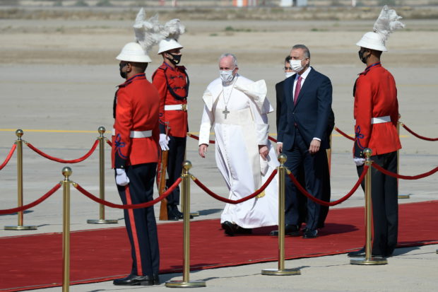Pope, starting risky trip, urges Iraq to end violence