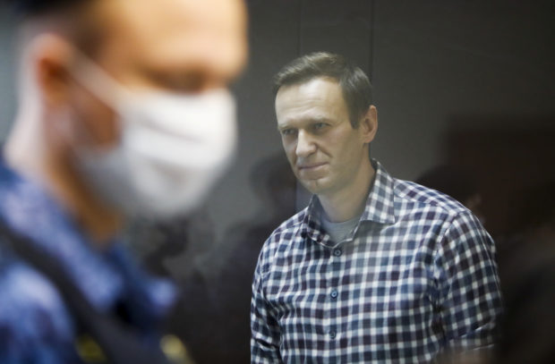 Britain and the United States sanctioned seven Russian officials on the first anniversary Friday of the near-fatal poisoning of jailed Kremlin critic Alexei Navalny, which the West blames on Moscow.