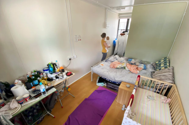 HK's hard COVID-19 rules see babies isolated, families cramped in tiny spaces