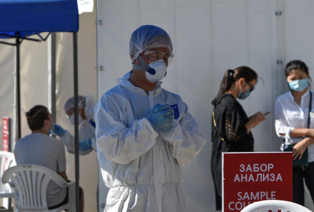 FILE PHOTO: Medical specialists work at the coronavirus disease (COVID-19) testing facility in Almaty