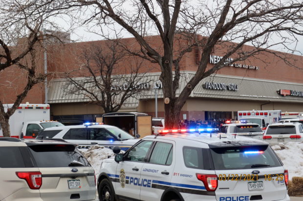 Police vehicles are seen at the scene where an active shooter was reported at a grocery store in Boulder