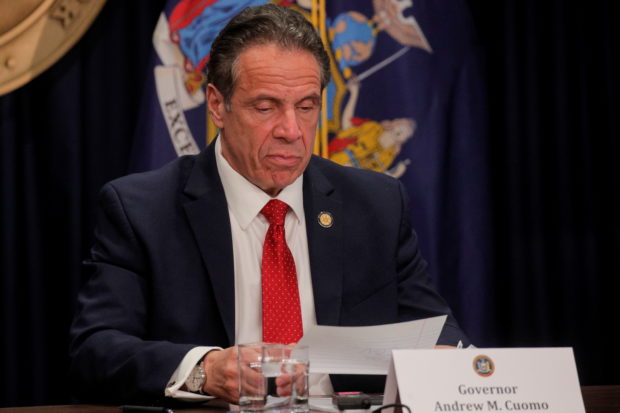 New York Governor Andrew Cuomo reads a note during a news conference at his offices in New York City, U.S. March 24, 2021