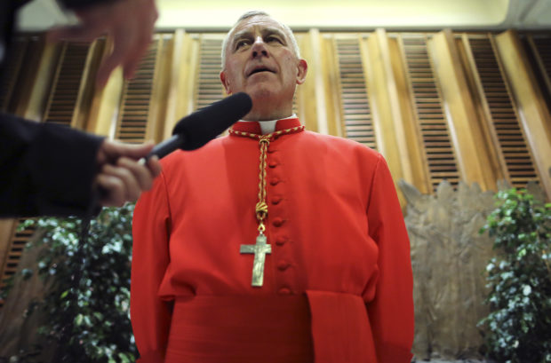 FILE PHOTO: Newly elevated Cardinal John Atcherley Dew speaks with journalist after taking part in the Consistory at the Vatican