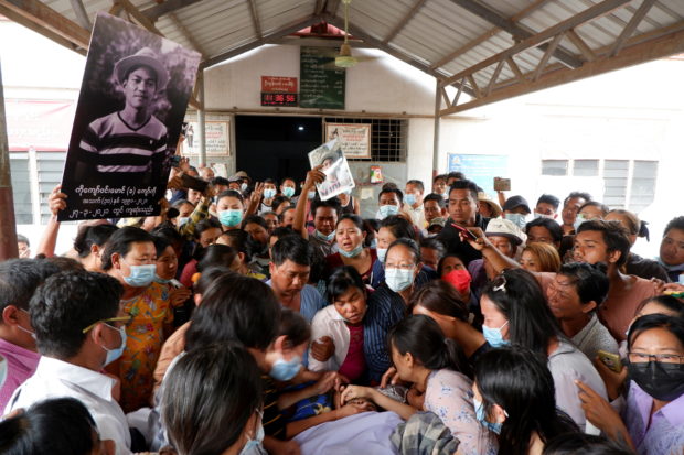 People mourn as they attend the funeral of Kyaw Win Maung, who was shot and killed during a protest against the military coup, in Mandalay, Myanmar March 28, 2021. REUTERS/Stringer