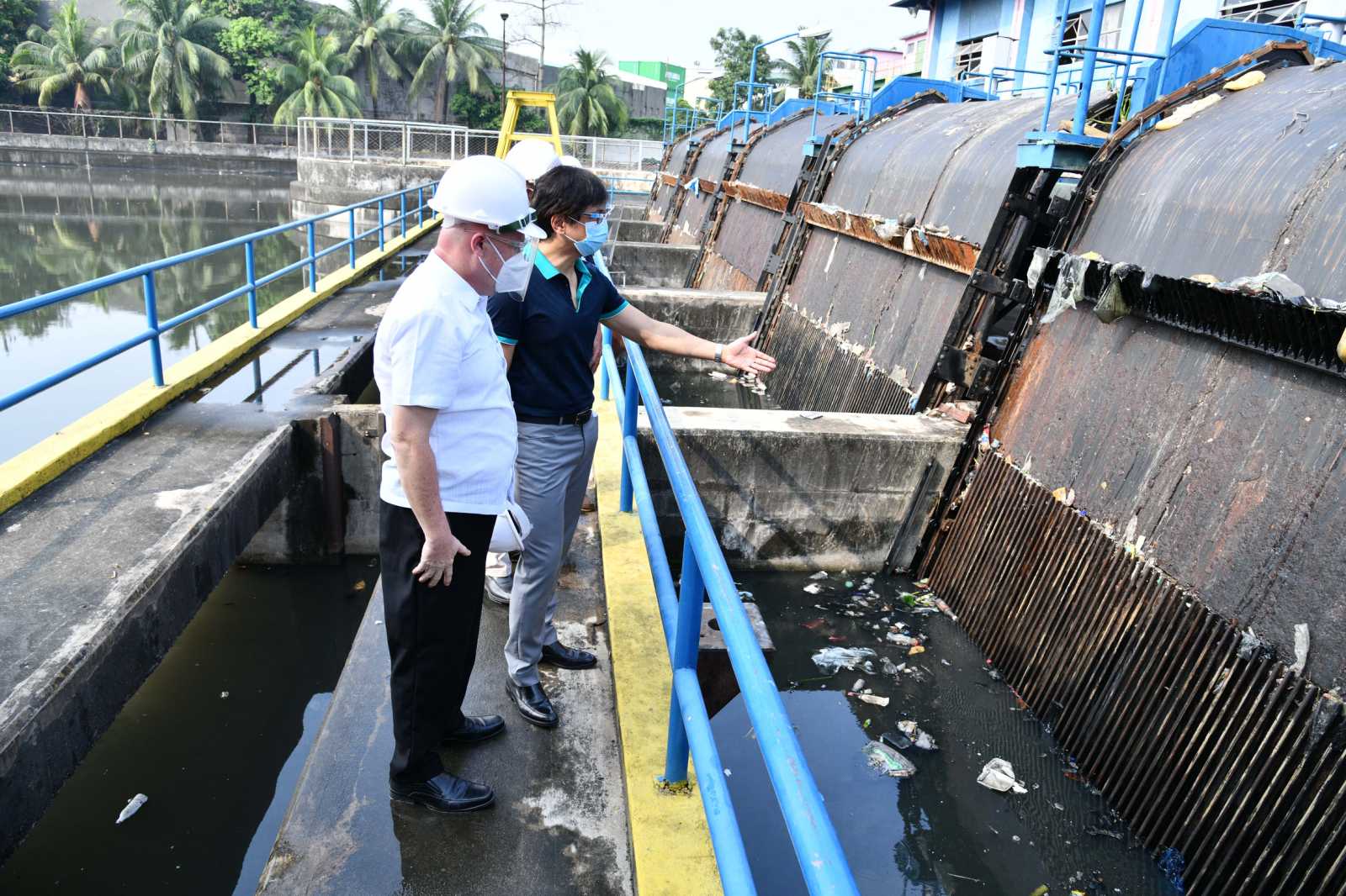 MMDA Chair Benhur Abalos inspects the equipment that is part of the brick-making facility 