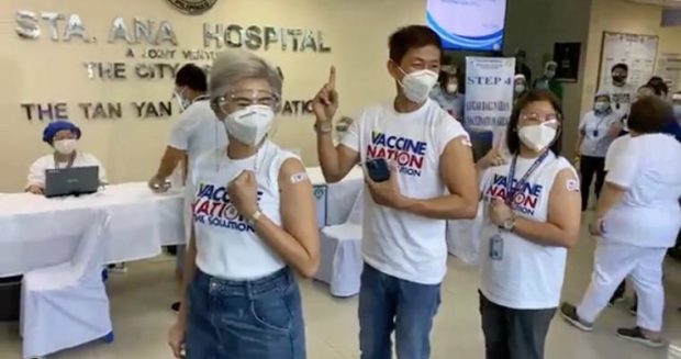 Manila City Vice Mayor Honey Lacuna-Pangan (leftmost) and city health officer Dr. Arnold Pangan (center) pose for a photo after being vaccinated with CoronaVac at the Sta. Ana Hospital on Tuesday, March 2, 2021. 