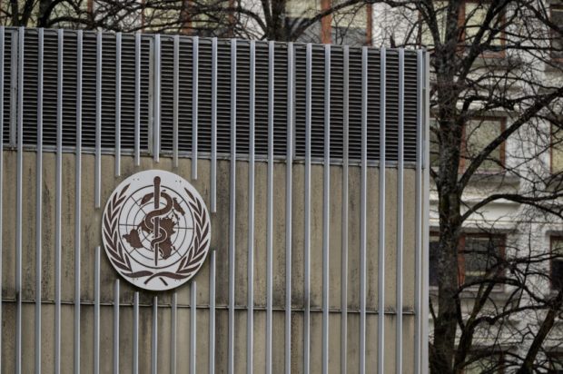 This photograph taken on March 5, 2021 shows the sign of the World Health Organization (WHO) at their headquarters in Geneva amid the Covid-19 coronavirus outbreak. (Photo by Fabrice COFFRINI / AFP)