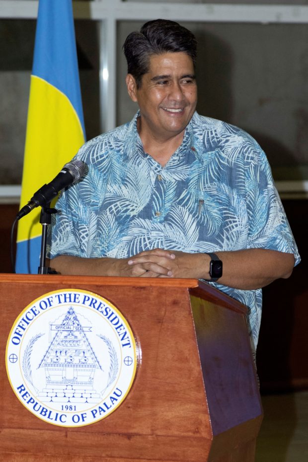 In this photo taken on April 1, 2021, Palau President Surangel Whipps speaks as he greets tourists from Taiwan during their arrival in Koror after Taiwan and Palau launched a rare holiday travel bubble as the two diplomatic allies try to kickstart their battered tourist industries after successfully keeping Covid-19 infections at bay. (Photo by Richard W. BROOKS / AFP)