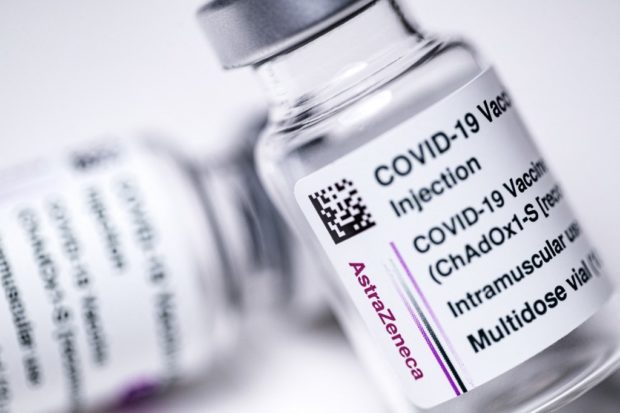 In this file photo taken on March 11, 2021 This picture shows vials of the AstraZeneca Covid-19 vaccine in Paris. - AstraZeneca said on April 7, 2021, that two studies conducted by British and European regulators "reaffirmed" that the benefits of its vaccine "far outweigh the risks" despite finding a possible link to rare blood clots. "Overall, both of these reviews reaffirmed the vaccine offers a high-level of protection against all severities of COVID-19 and that these benefits continue to far outweigh the risks," the British/Swedish company said in a statement. 