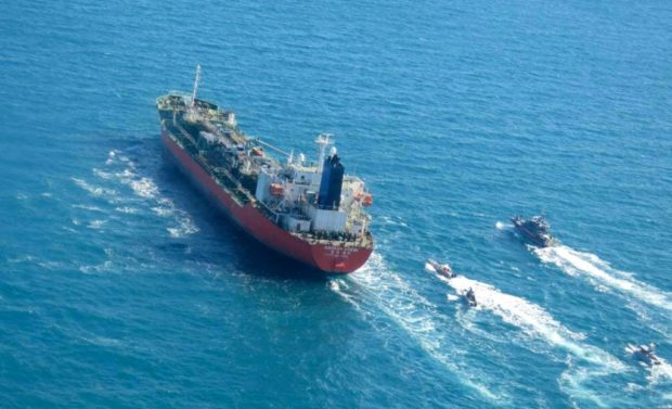  This file photo obtained by AFP from the Iranian news agency Tasnim on January 4, 2021, shows the South Korean-flagged tanker being escorted by Iran's Revolutionary Guards navy after being seized in the Gulf. - Iran has released the South Korean-flagged tanker 'Hankuk Chemi' it seized amid a dispute over billions in frozen oil funds, and the vessel's captain, the foreign ministry in Seoul said on April 9, 2021. (