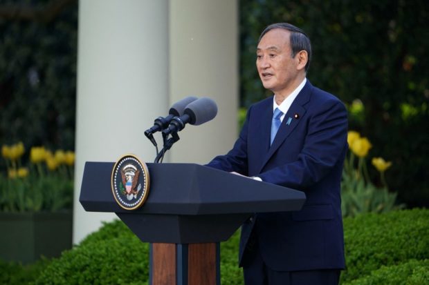 Japan's Prime Minister Yoshihide Suga speaks during a joint press conference with the US president in the Rose Garden of the White House in Washington, DC on April 16, 2021