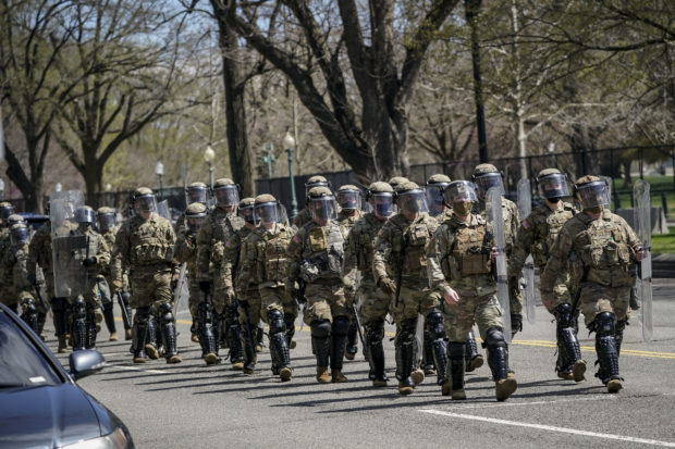 National Guard troops arrive along Constitution Avenue as law enforcement responds to a security incident near the U.S. Capitol on April 2, 2021 in Washington, DC. The U.S. Capitol was locked down after a person reportedly rammed a vehicle into two Capitol Hill police officers. A suspect was apprehended.   