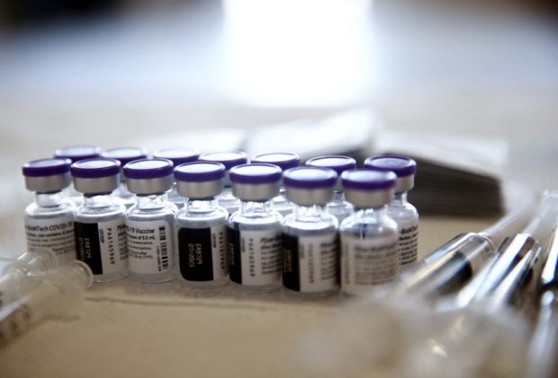 LOS ANGELES, CALIFORNIA - APRIL 09: Vials containing doses of the Pfizer COVID-19 vaccine are viewed at a clinic targeting minority community members at St. Patrick's Catholic Church on April 9, 2021 in Los Angeles, California. St. John's Well Child and Family Center is administering COVID-19 vaccines ?in churches across South L.A. in a broad effort to bring vaccines to minority? communities. 