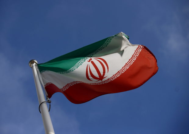 The Iranian flag waves in front of the International Atomic Energy Agency (IAEA) headquarters, before the beginning of a board of governors meeting, amid the coronavirus disease (COVID-19) outbreak in Vienna, Austria, March 1, 2021. REUTERS/Lisi Niesner