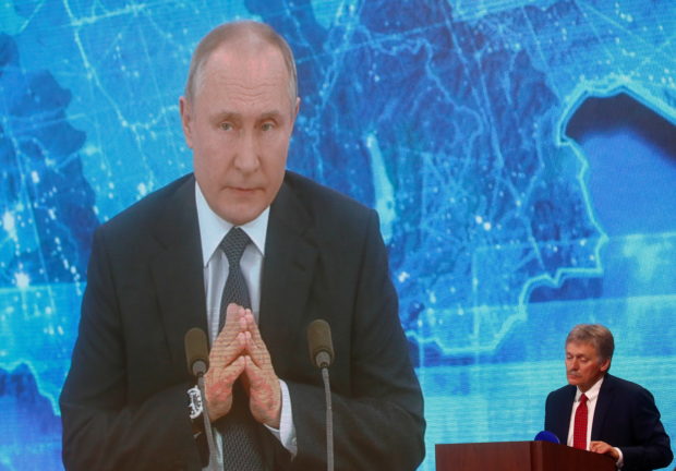 Kremlin spokesman Dmitry Peskov attends President Vladimir Putin's annual end-of-year news conference in Moscow