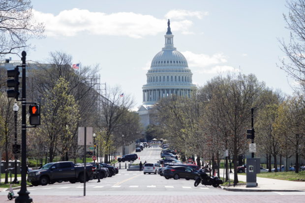 Law enforcement officers stand along a perimeter surrounding the U.S. Capitol and congressional office buildings following a security threat at the U.S. Capitol in Washington, U.S..