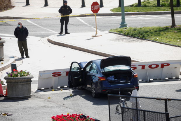A blue car is seen after ramming a police barricade outside the U.S. Capitol building in an incident that reportedly resulted in the death of one Capitol police officer, the injury of another officer and the death of the driver as a result of police gunfire on Capitol Hill in Washington, U.S. April 2, 2021. REUTERS/Tom Brenner