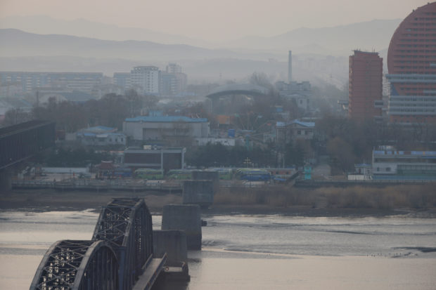 North Korea's Sinuiju and the Broken Bridge over the Yalu river are seen from Dandon