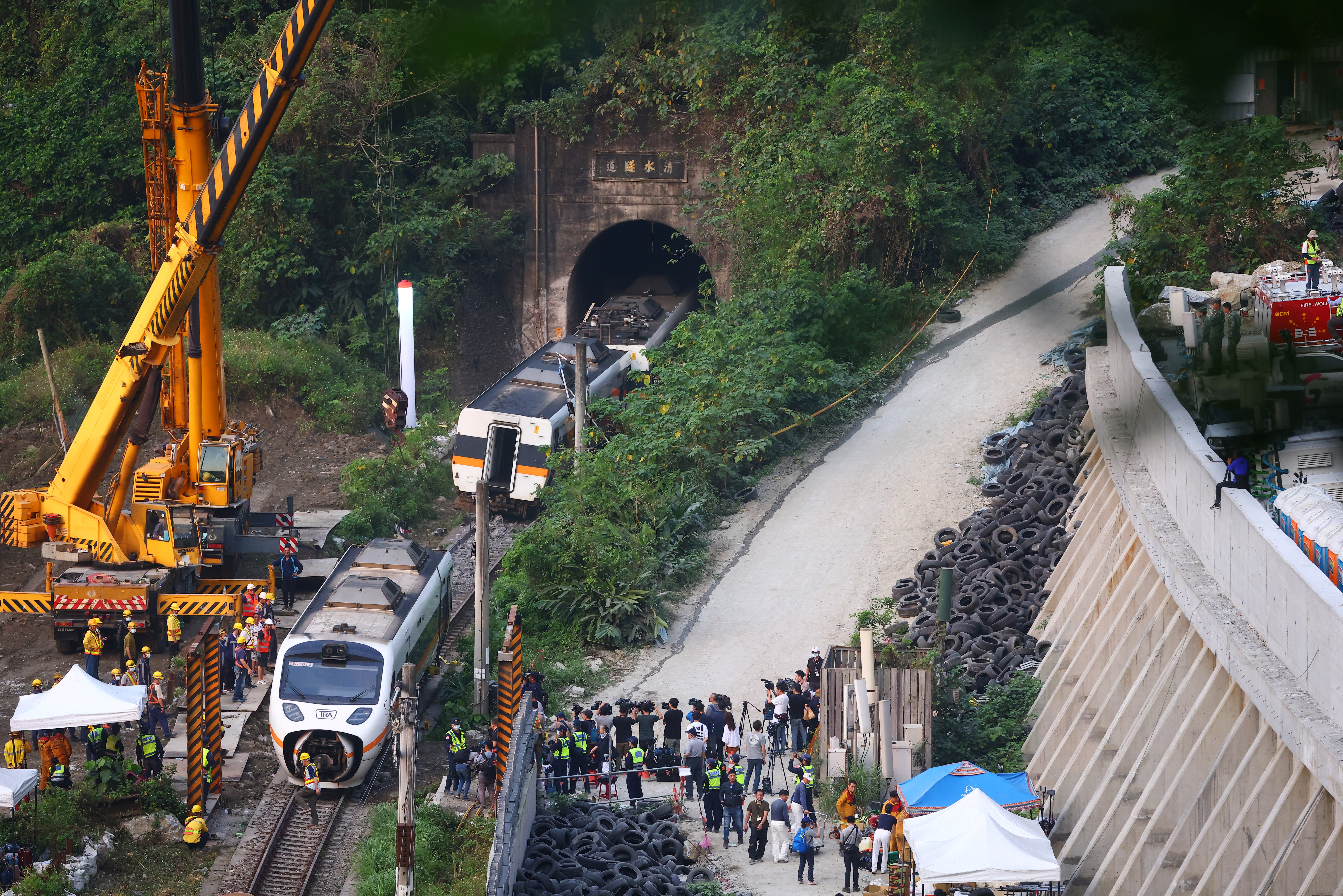 Rescuers work at the site a day after a deadly train derailment at a tunnel north of Hualien, Taiwan