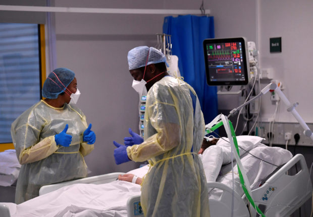 Nurses react as they treat a COVID-19 patient in the ICU (Intensive Care Unit) at Milton Keynes University Hospital, amid the spread of the coronavirus disease (COVID-19) pandemic, Milton Keynes, Britain, January 20, 2021. 