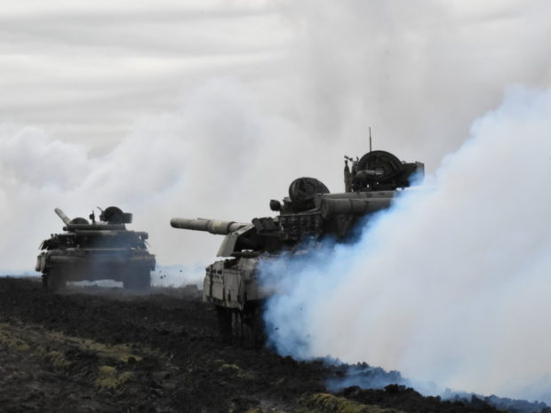 Tanks of the Ukrainian Armed Forces are seen during drills at an unknown location near the border of Russian-annexed Crimea, Ukraine, in this handout picture released by the General Staff of the Armed Forces of Ukraine press service April 14, 2021