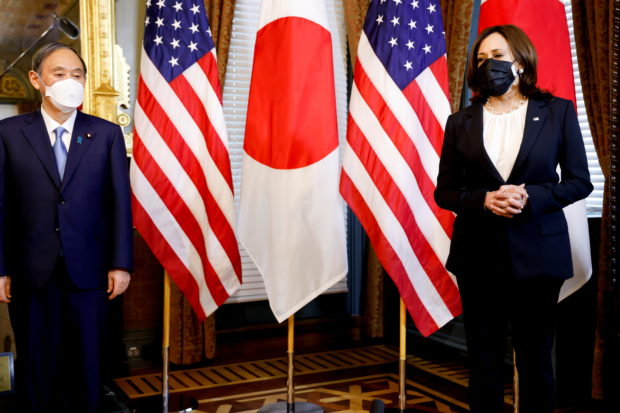 U.S. Vice President Kamala Harris meets Japanese Prime Minister Yoshihide Suga in her ceremonial office in the Eisenhower Executive Office Building at the White House in Washington, U.S., April 16, 2021. REUTERS/Jonathan Ern