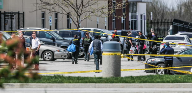 Investigators are on the scene following a mass shooting at a FedEx facility in Indianapolis, Indiana, U.S., April 16, 2021