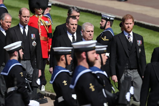 Britain's Prince Harry, Duke of Sussex, Britain's Britain's Prince Andrew, Duke of York, Peter Phillips and Britain's Prince William, Duke of Cambridge, follow the hearse, a specially modified Land Rover, during the funeral of Britain's Prince Philip, husband of Queen Elizabeth, who died at the age of 99, on the grounds of Windsor Castle in Windsor, Britain, April 17, 2021