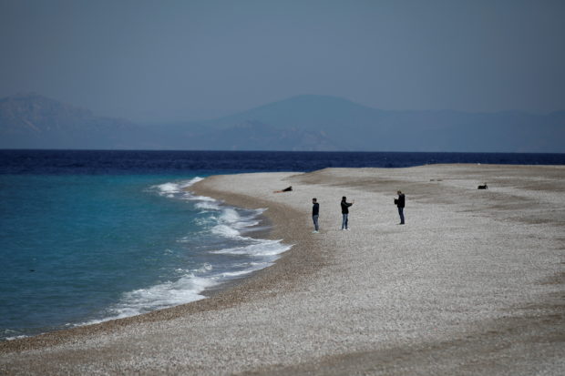 Greece opens to tourists, anxious to move on from crisis season