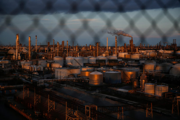 Chemical plants and refineries near the Houston Ship Channel are seen next to the Manchester neighborhood in the industrial east end of Houston, Texas, U.S., August 9, 2018. REUTERS/Loren Elliott
